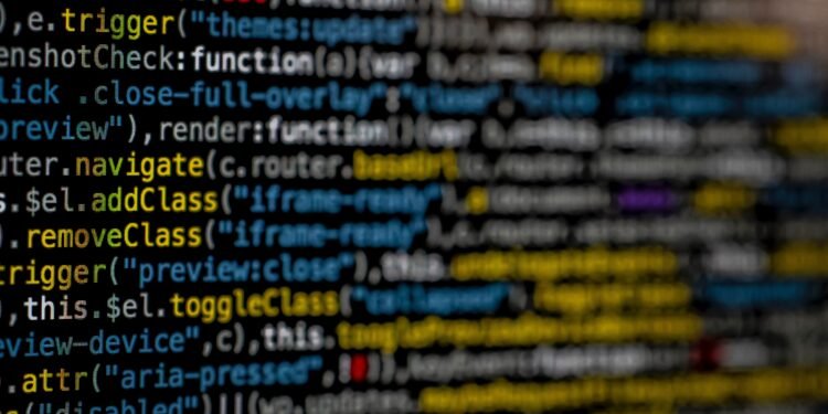 Yellow and blue data code displayed on screen by markus-spiske
