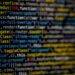 Yellow and blue data code displayed on screen by markus-spiske